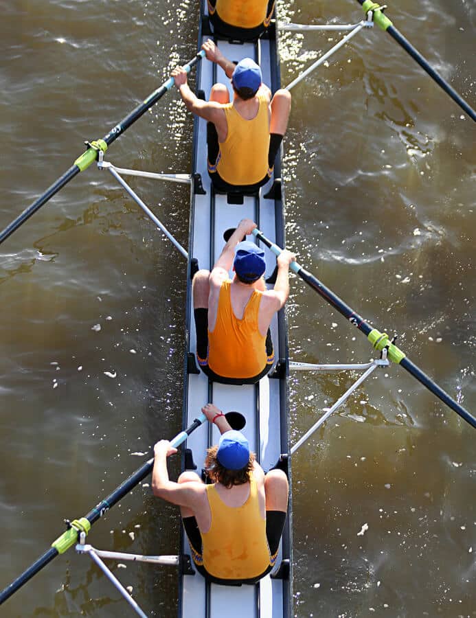 Rowing crew on river as a metaphor for teamwork