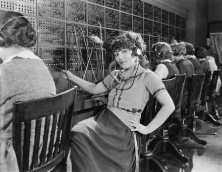 Female operator in telephone exchange - vintage image