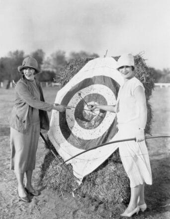 Two women by an archery target